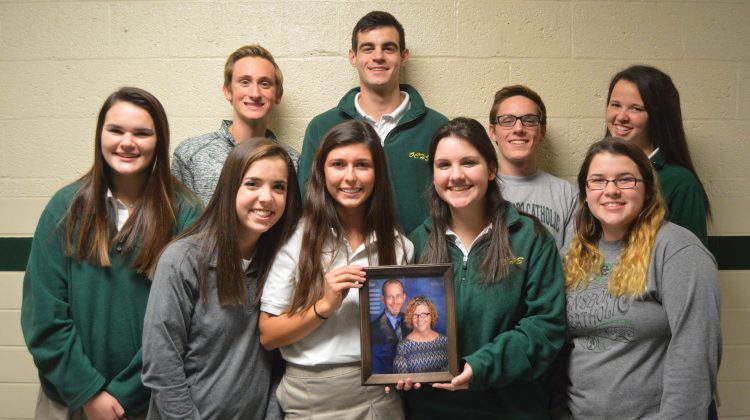 Group Photo of Students Holding Picture of their Teacher