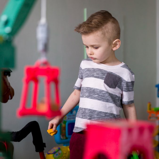 Young Boy Playing in Toy Room