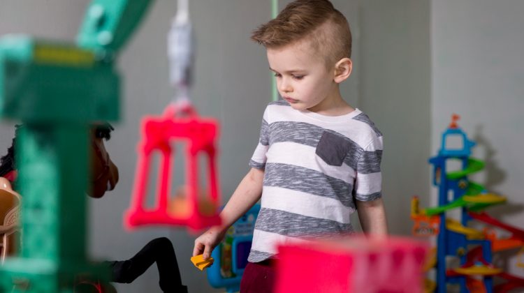 Young Boy Playing in Toy Room