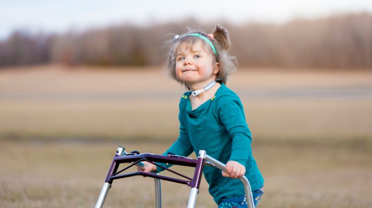 Young Girl with Walker Outside