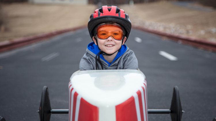 Young Boy in Soap Box Derby Car