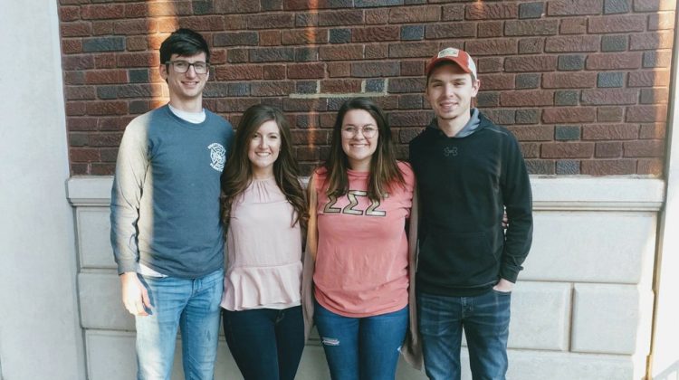 Four Young Friends Gathered for a Picture