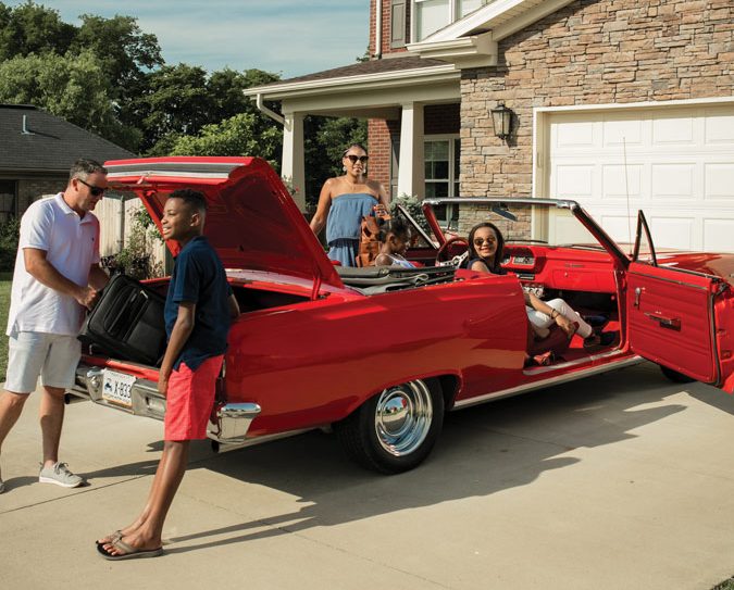 Family Gathered Around a Car