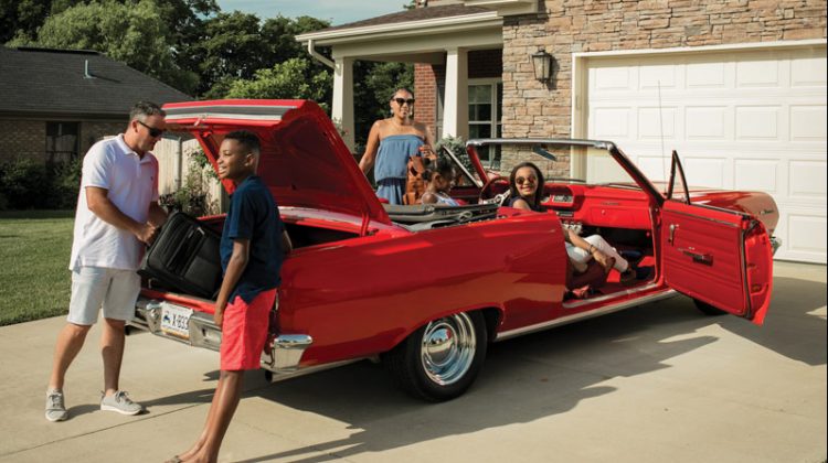 Family Gathered Around a Car