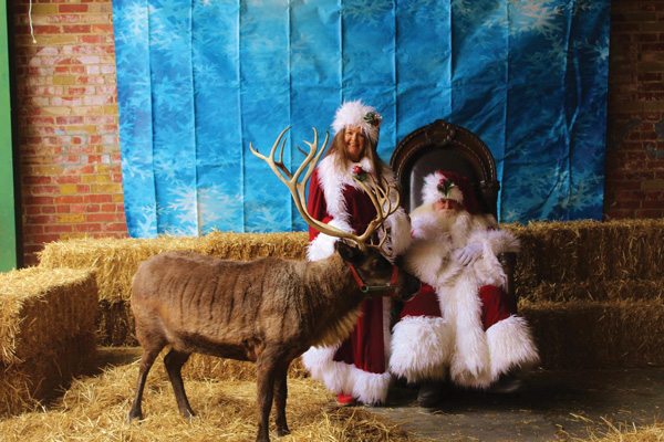 Santa and Mrs. Claus with reindeer