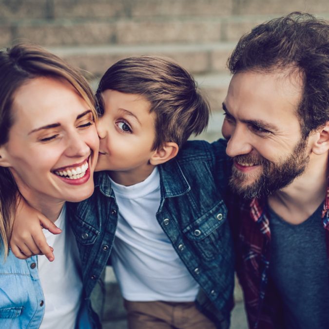 Young boy with mom and dad