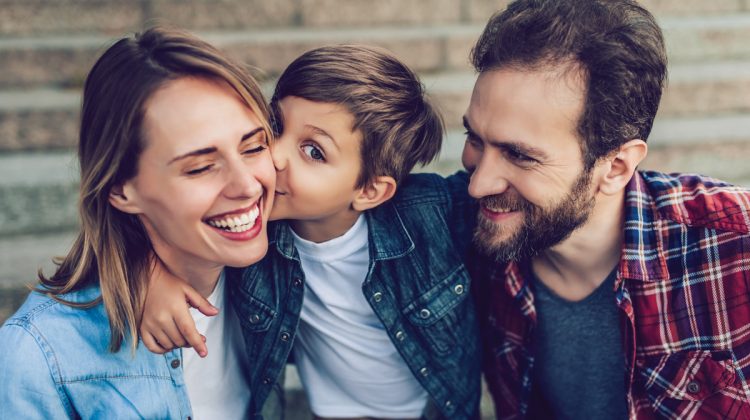 Young boy with mom and dad