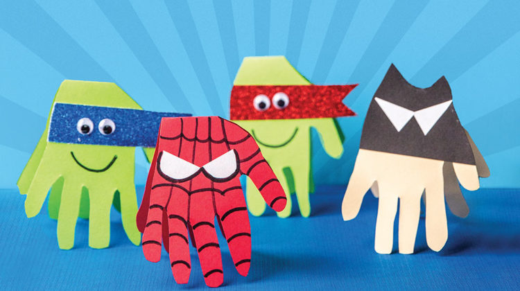 Paper hands decorated like superheros