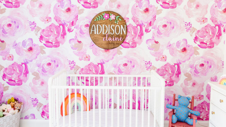 Daughter Addison's bedroom with bright pink, floral wallpaper and wooden sign that says her name