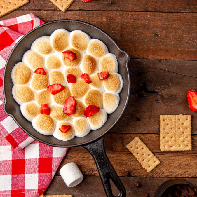 Indoor s'mores dip with strawberries on top