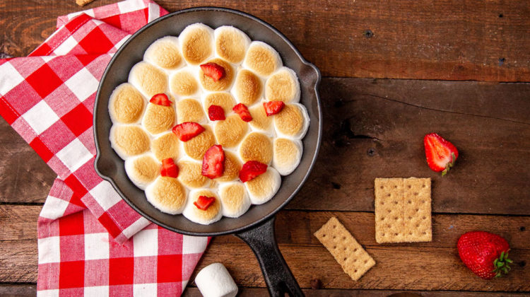 Indoor s'mores dip with strawberries on top