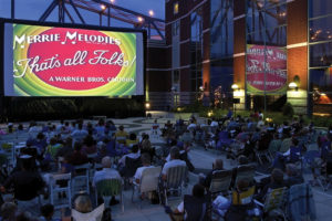 Movie screen set up downtown by the river