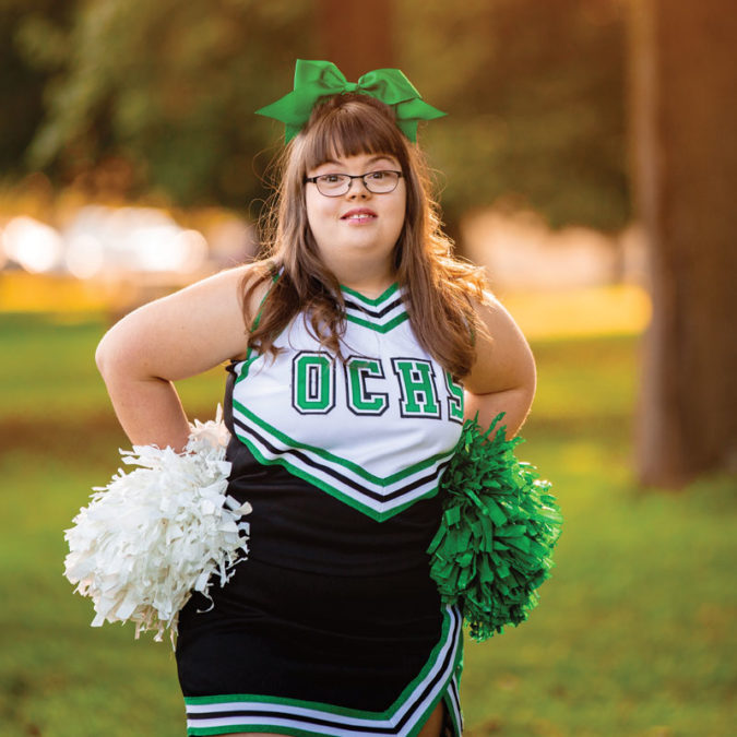 Portrait of cheerleader Ann Switzer in the park