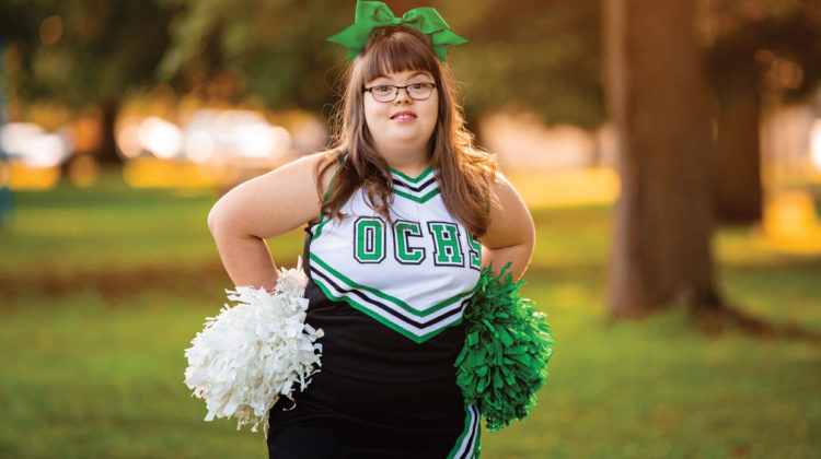 Portrait of cheerleader Ann Switzer in the park