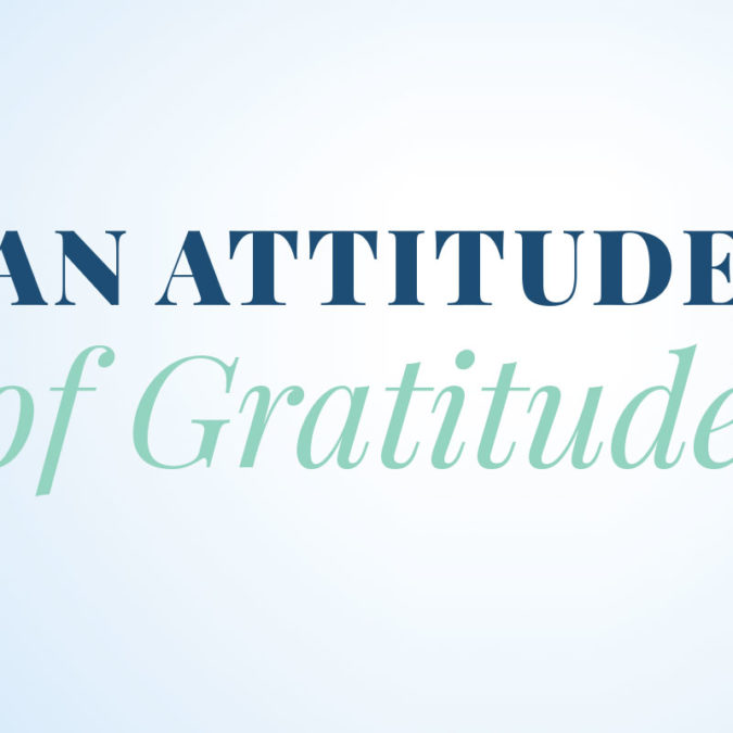 "An Attitude of Gratitude" writted on light blue background