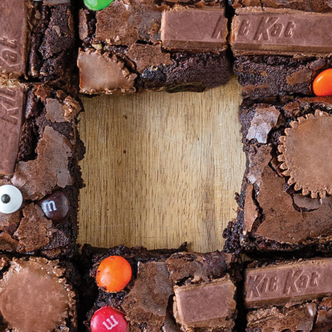 Overhead photo of brownies with leftover Halloween candy in them