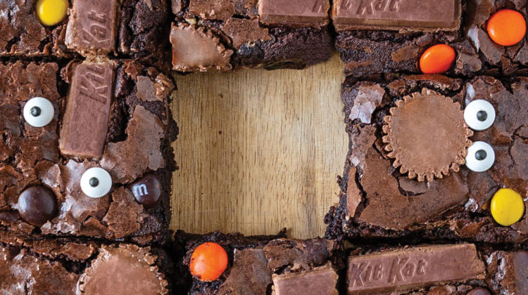 Overhead photo of brownies with leftover Halloween candy in them