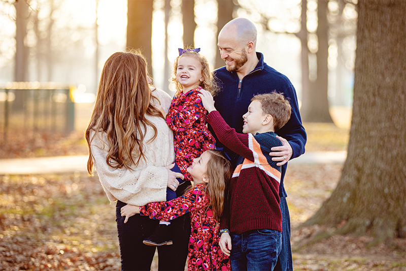 The Hayden family smiling and laughing during a group photo