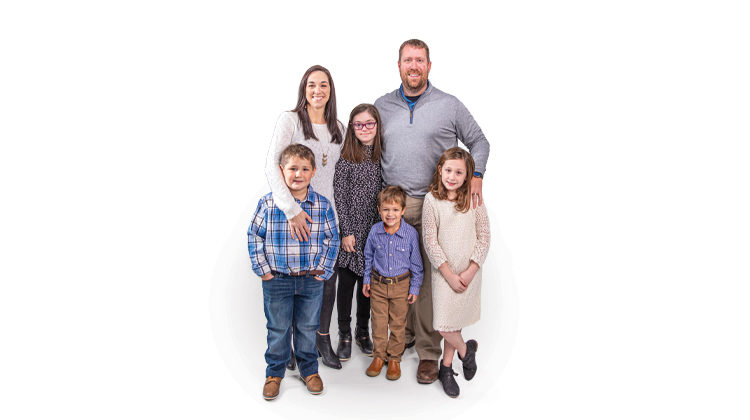 Rick Ebelhar and his family smiling for a photo